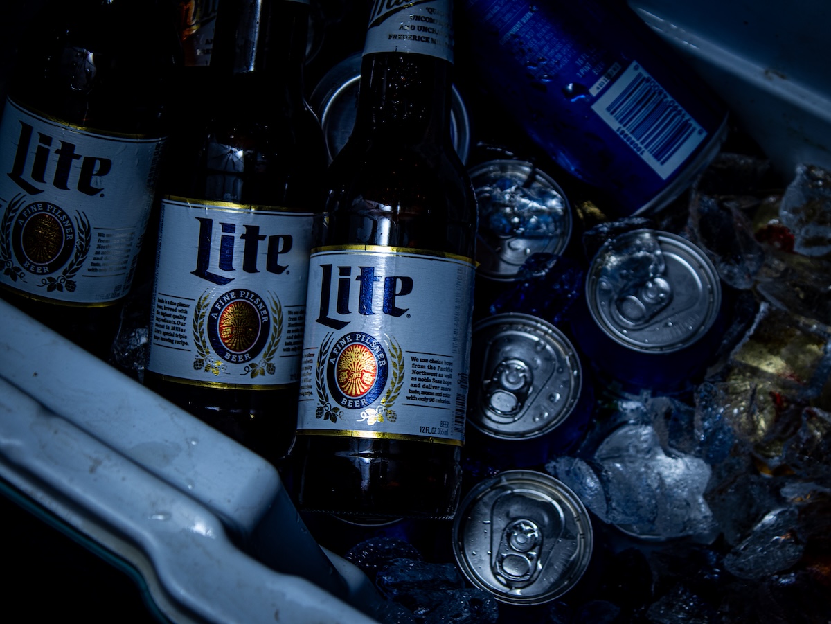 Lite cans and bottles with dramatic shadows